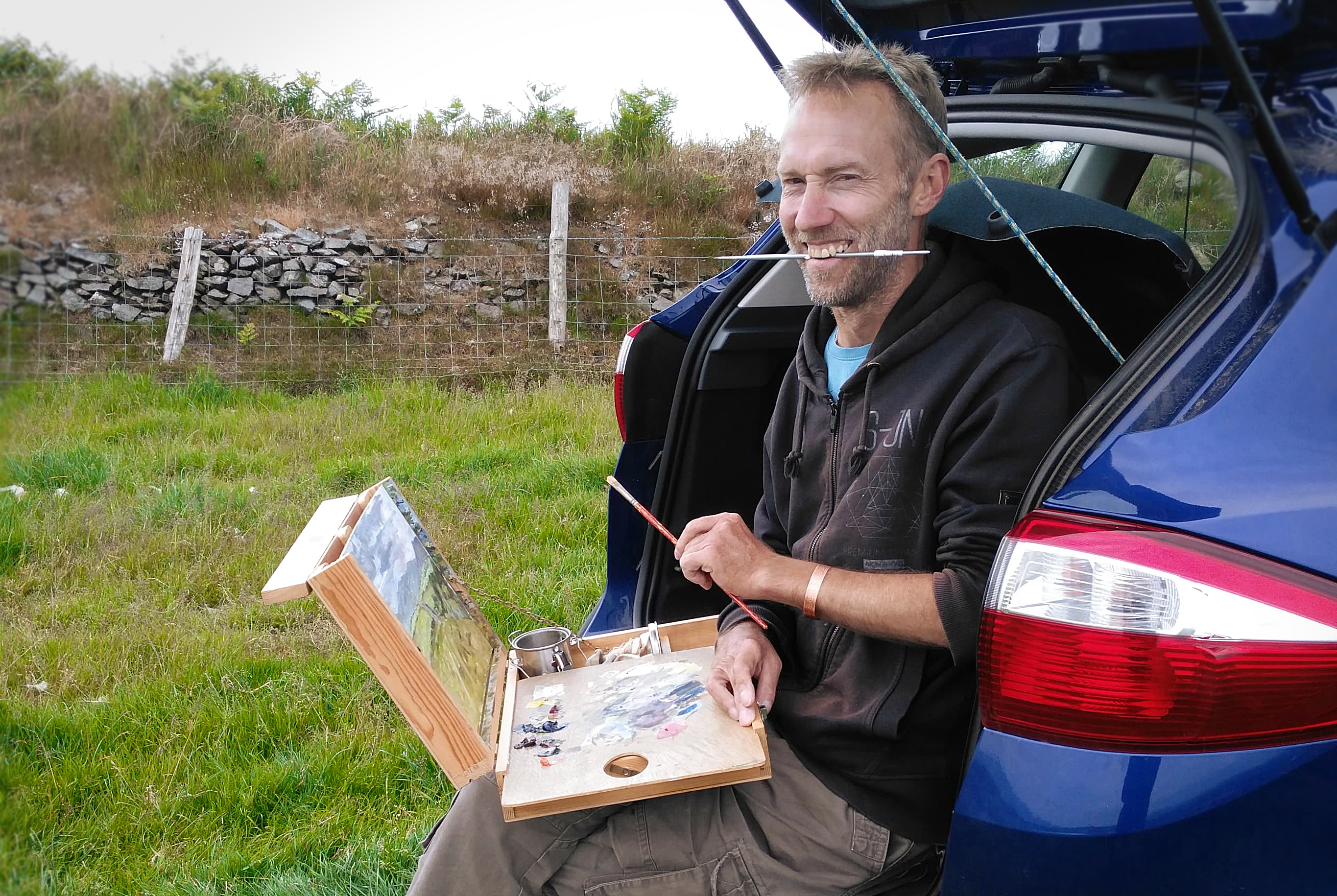 Artist Chris Chalk painting outdoors